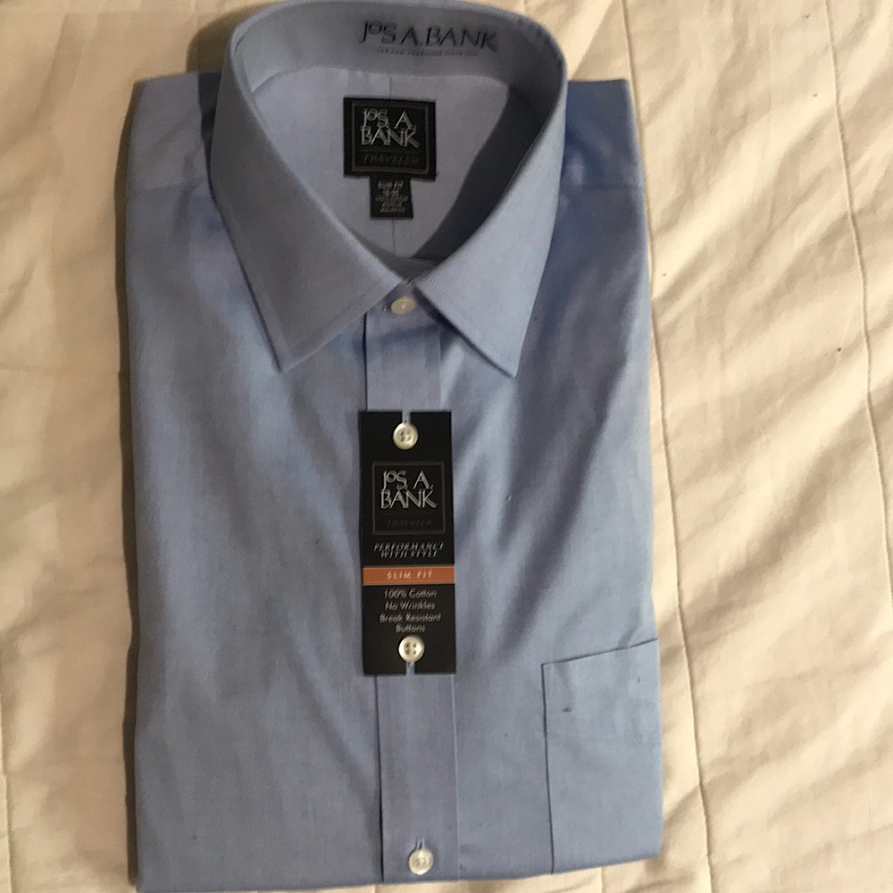 Never worn, Medium Blue Jos A Bank Dress Shirt